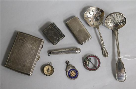 A Victorian silver sifter spoon, a sterling spoon, a silver cigarette case, a silver Howitt lighter etc.